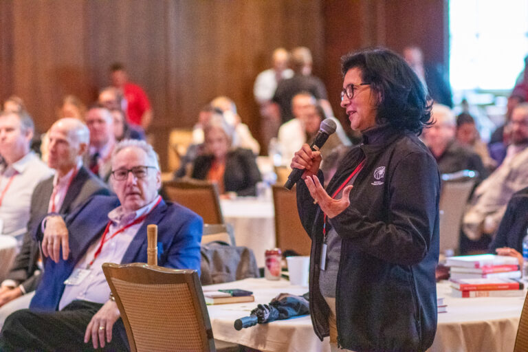 audience member asking question at digital symposium